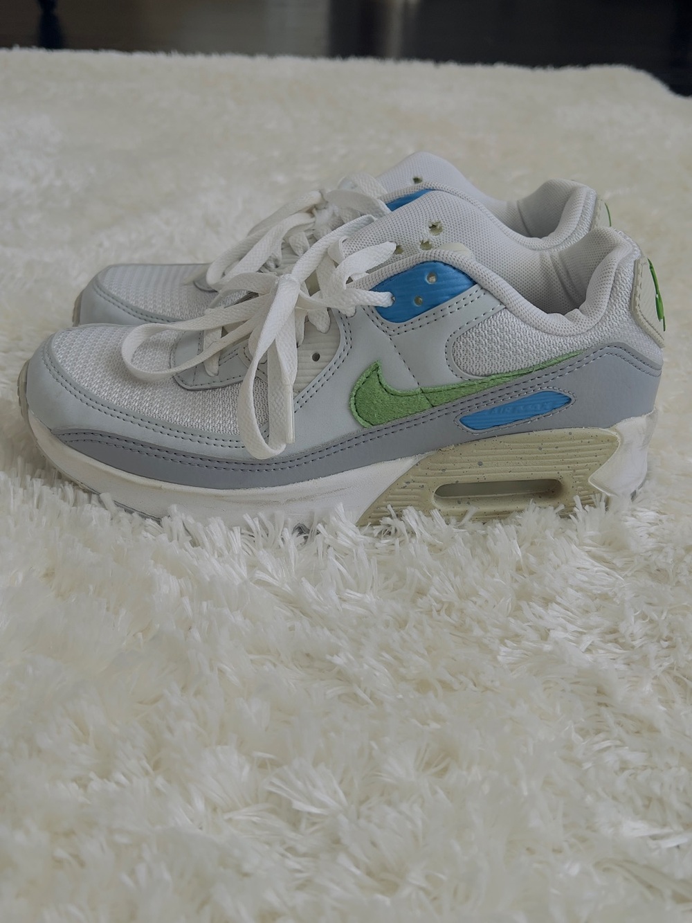 Nike Air Max 90 sneakers in white with blue and green accents